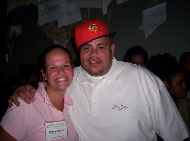 Chrissy Carroll and Fat Joe at a conference.