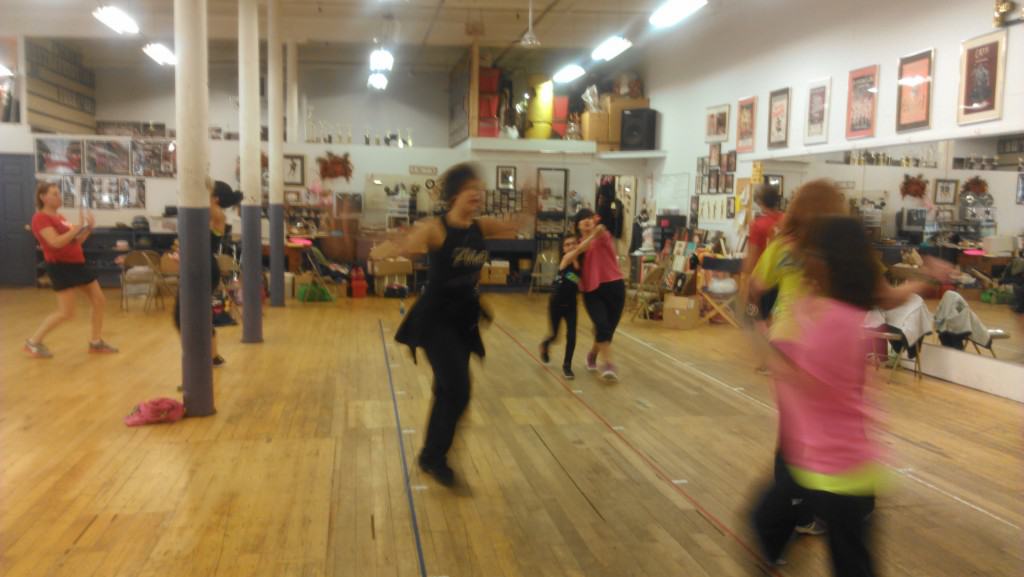 People dancing at a Zumba kids training.