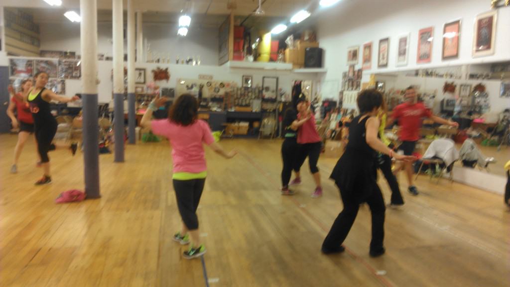 People dancing at a Zumba kids training.