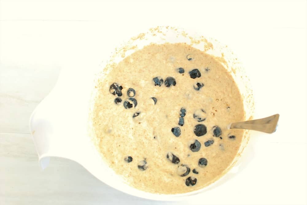 Pancake batter in a white mixing bowl.