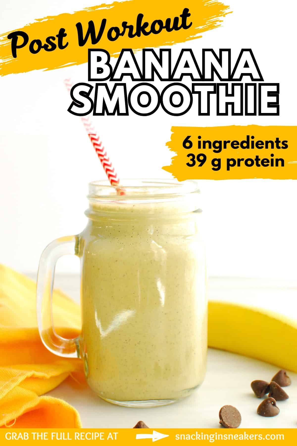 A glass filled with a post-workout banana smoothie, next to a napkin and a banana, with a text overlay with the name of the recipe.
