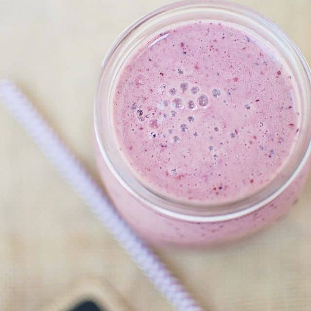 Chocolate cherry recovery smoothie in a mason jar.