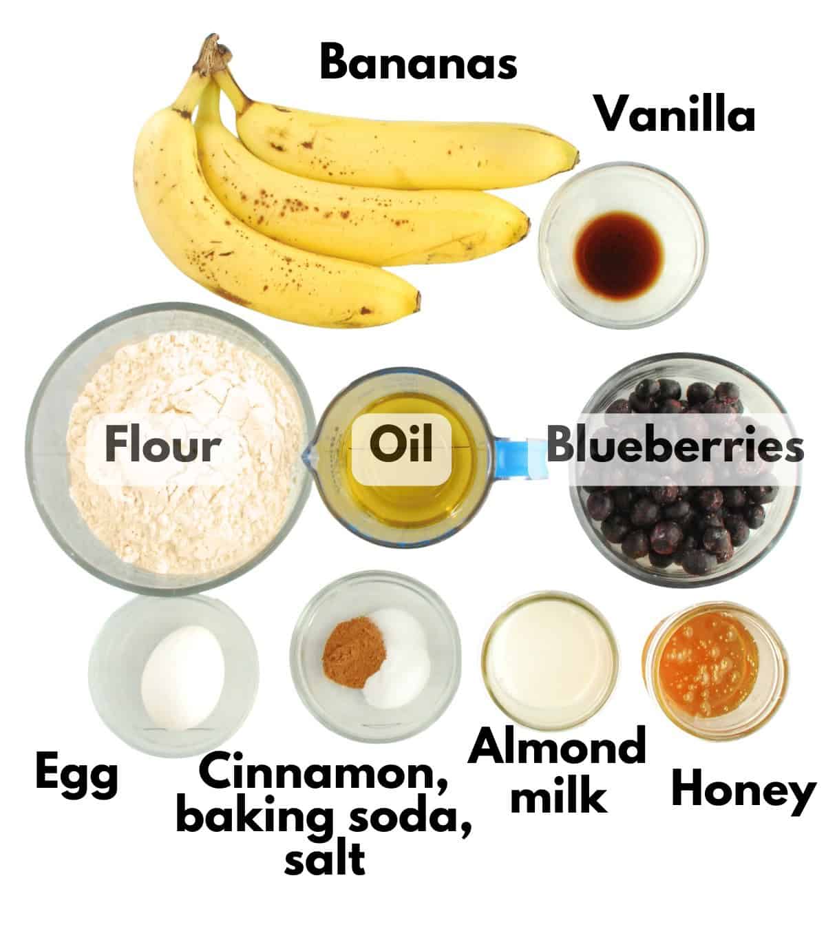 Bananas, vanilla, flour, oil, blueberries, egg, cinnamon, baking soda, salt, almond milk, and honey.
