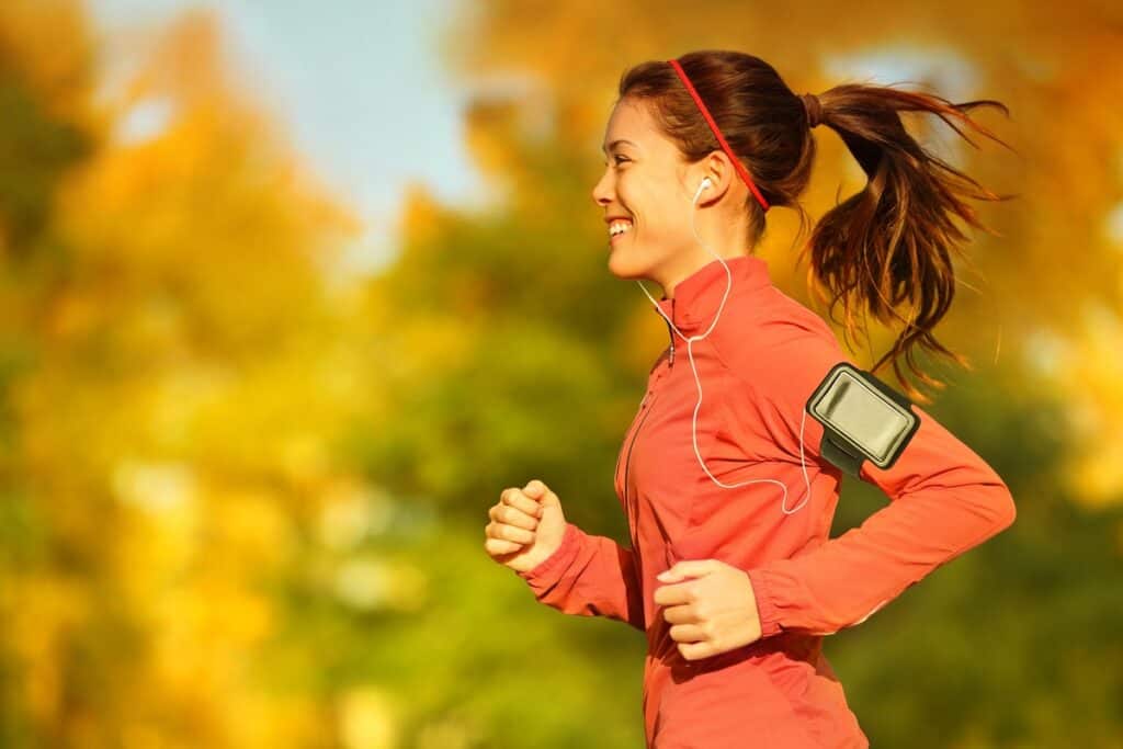 A woman listening to 90's music on her run.