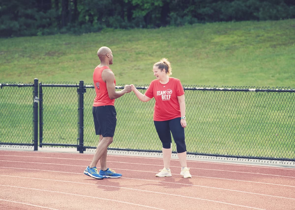 A husband and wife at a track.