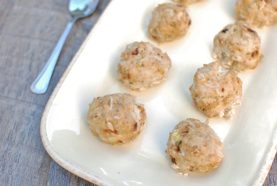 A plate filled with chicken apple meatballs.