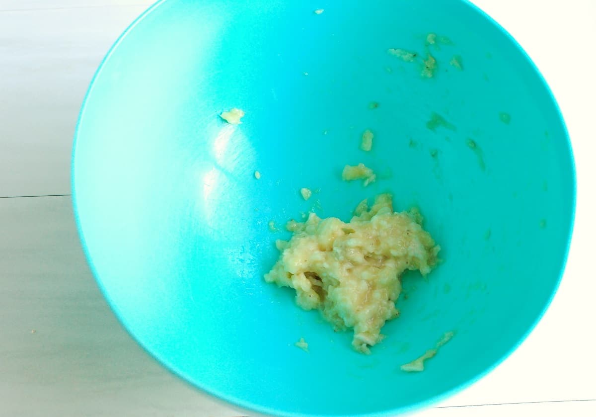 A banana mashed in a bowl.