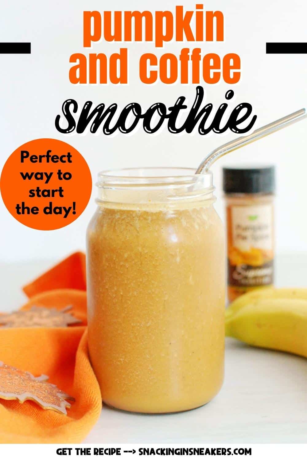 A mason jar filled with pumpkin coffee smoothie, with a straw in it and an orange napkin next to it.