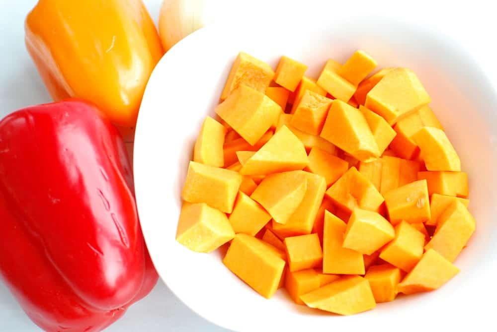 Peeled and chopped butternut squash in a bowl.