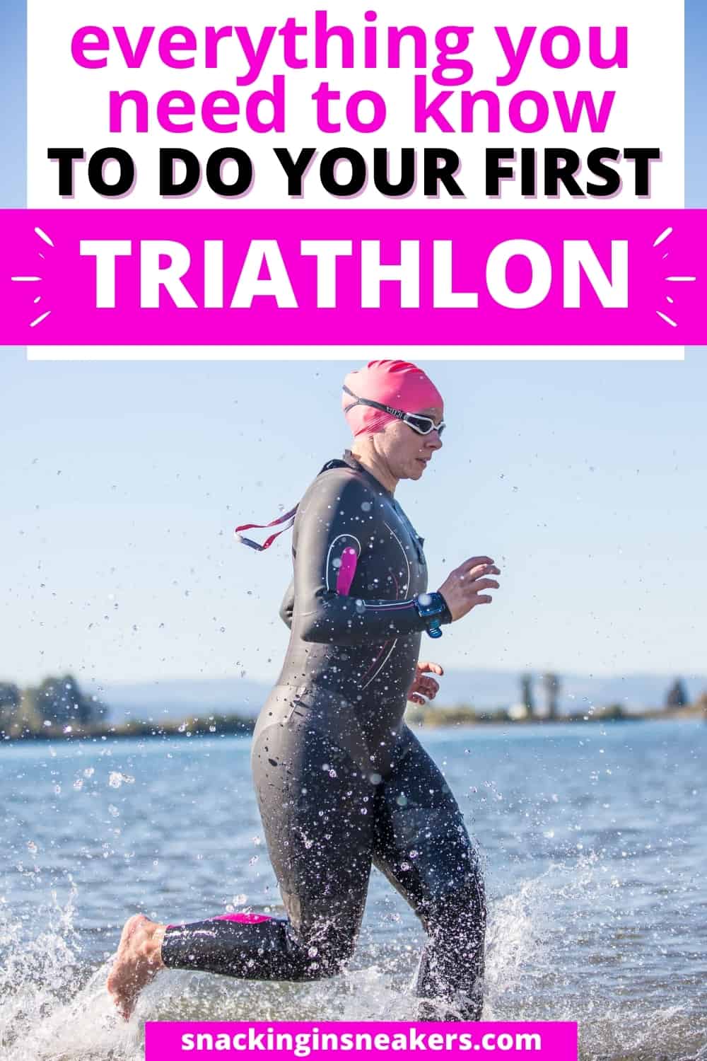 A woman in a wetsuit running into the water to do her first triathlon.