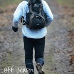 A person running outside in cold weather with a text overlay that says off season nutrition tips for runners and triathletes.