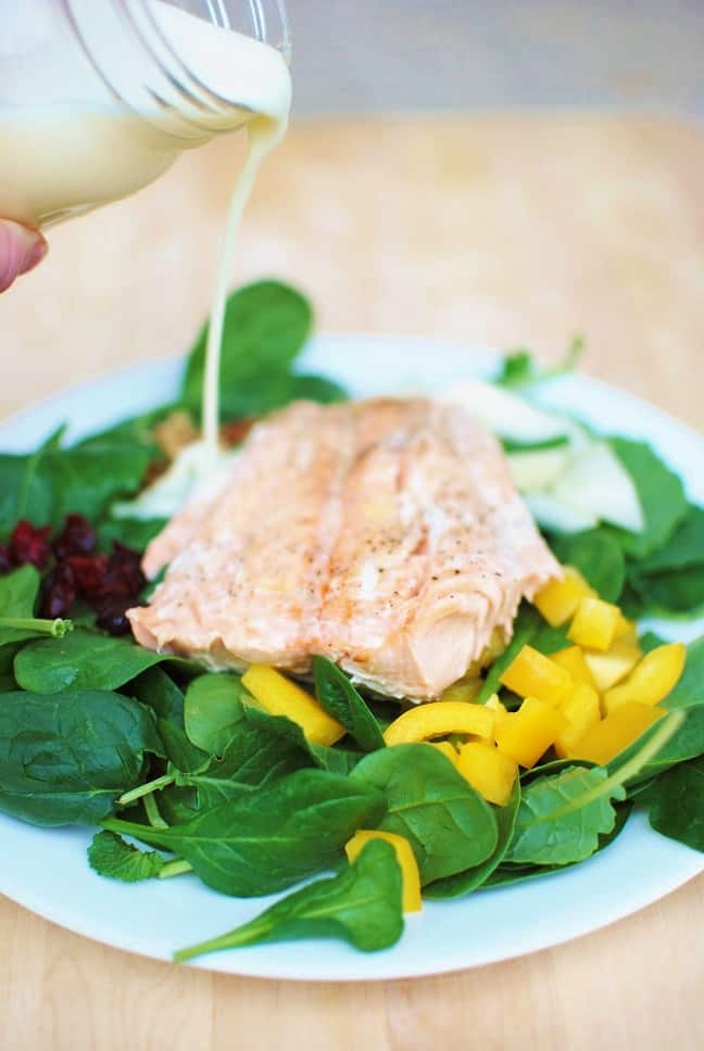 This salad featuring salmon, bell peppers, pear, and walnuts - and all topped off with a creamy citrus dressing - is such a nutrition power-packed meal!