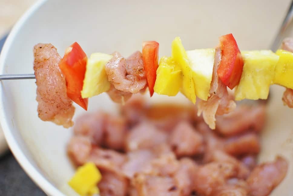 Making Turkey Kabobs with turkey tenderloin, red pepper, and pineapple