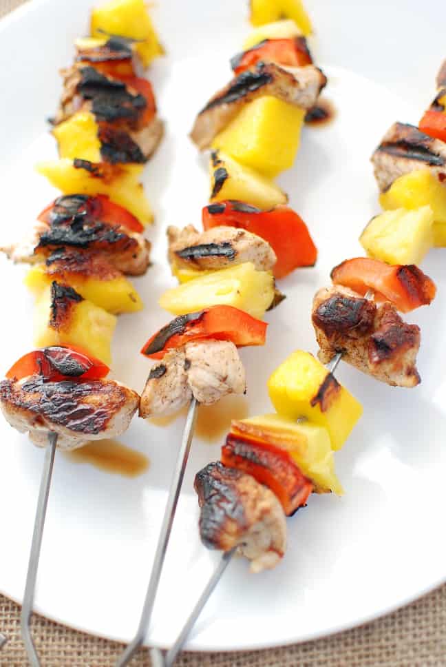 Three Caribbean jerk grilled turkey tenderloin kabobs on a plate