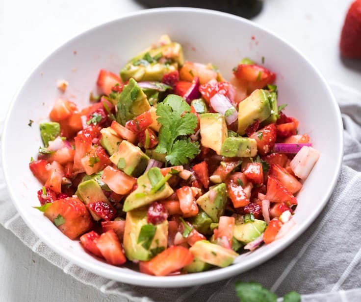 A bowl of strawberry avocado salsa.