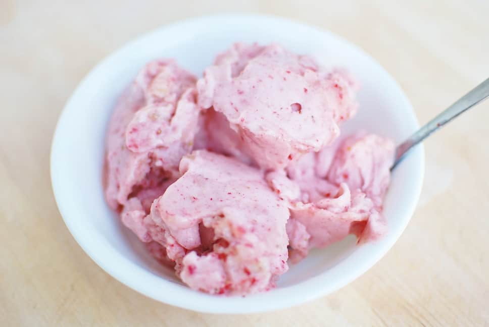 Several scoops of strawberry banana nice cream in a bowl.