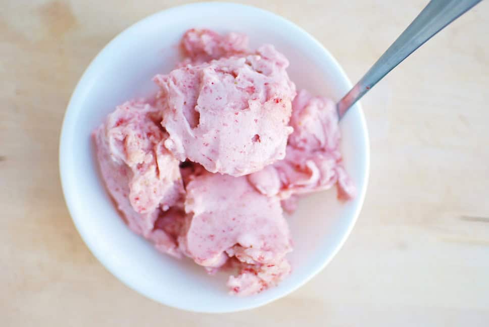 A bowl of strawberry banana soft serve nice cream.