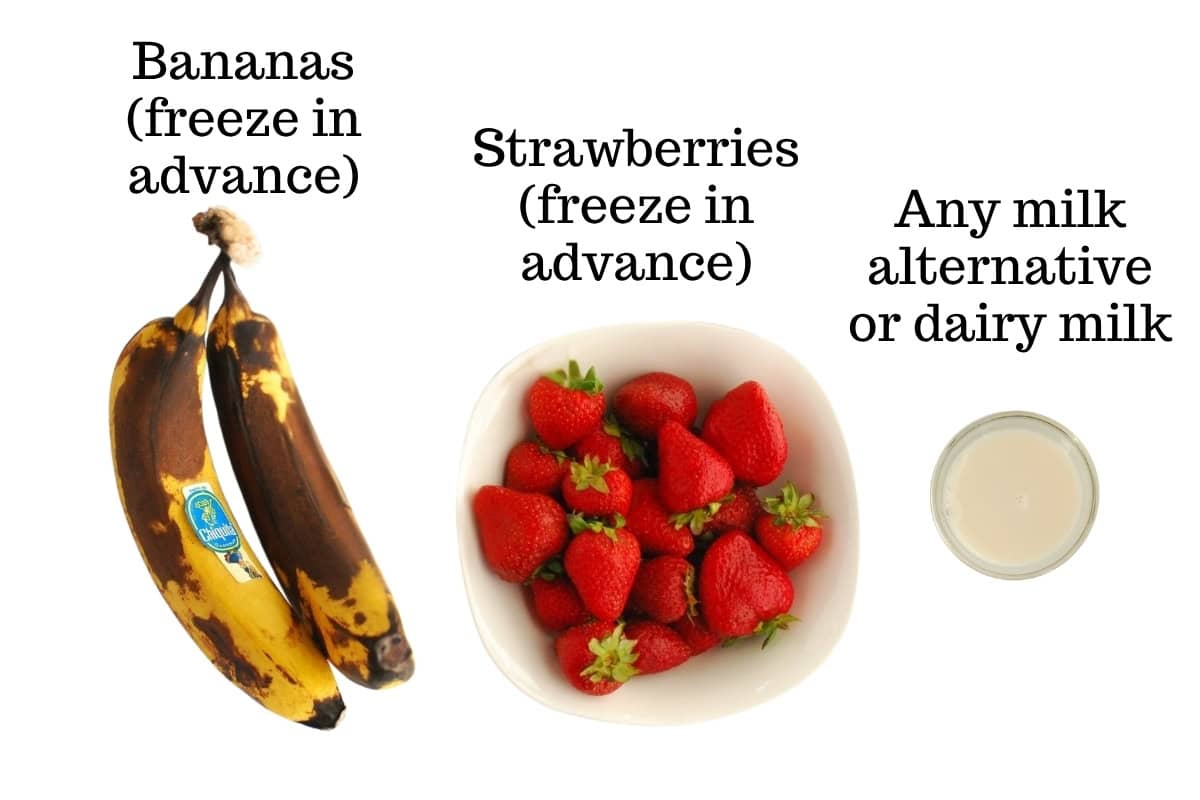 Bananas, strawberries, and a milk alternative on a white backdrop.