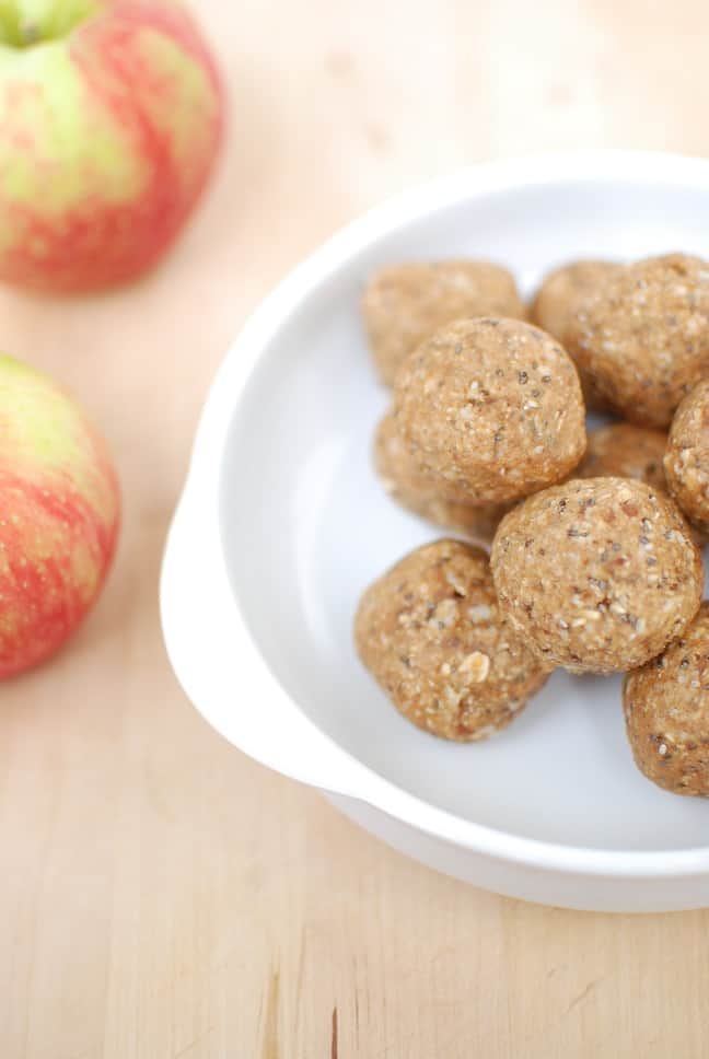 These no bake apple peanut butter energy bites are a great snack for adults and kids alike. This family friendly recipe takes just a few minutes to make in the food processor and can be stored in the fridge for easy snacking throughout the week.