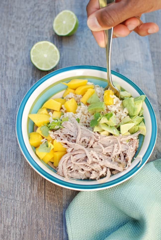 YUM! These pork burrito bowls with avocado and mango are so easy to make. Less than 10 ingredients to pick up at the store and less than 30 minutes of prep time! A great healthy dinner recipe. 