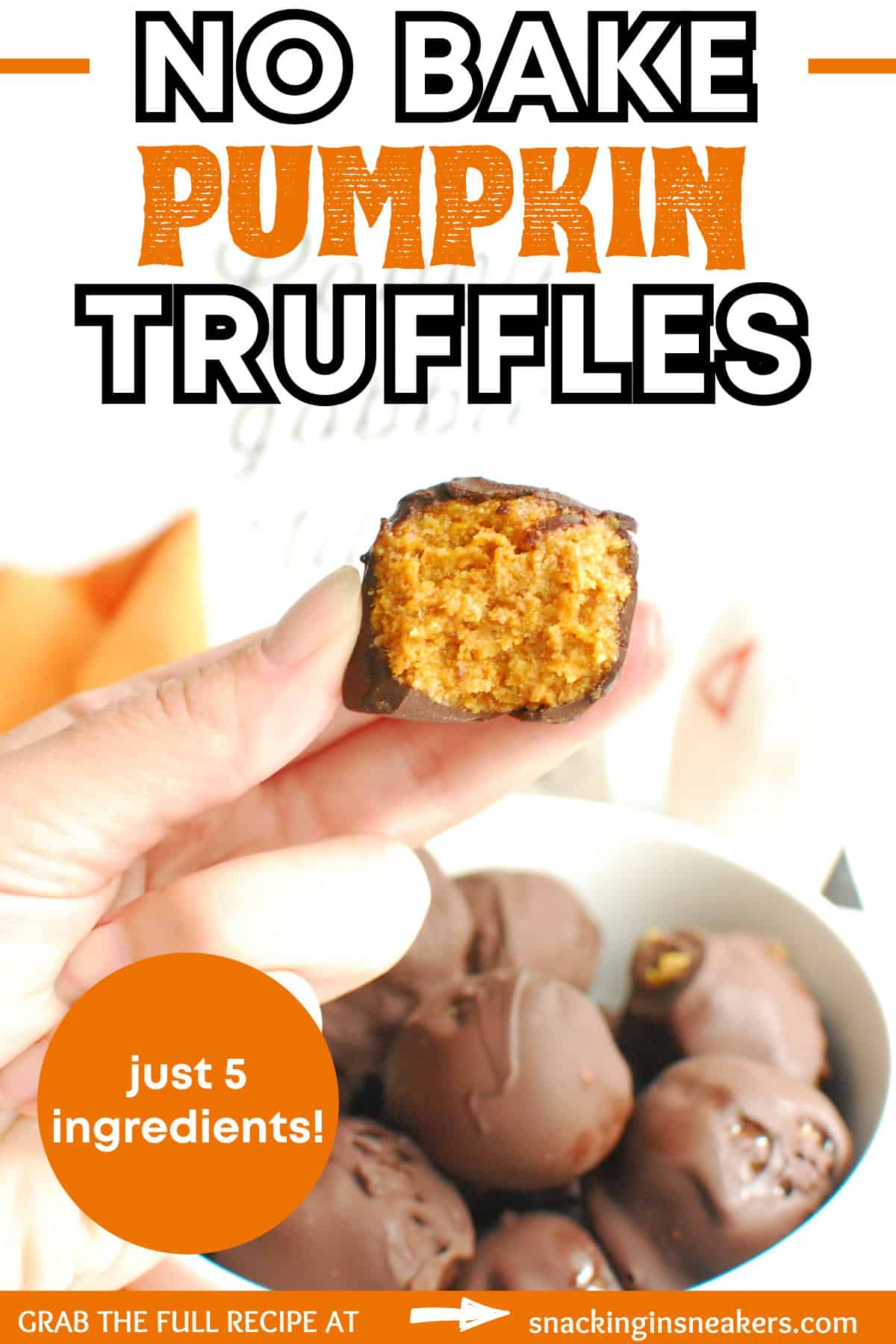 A woman's hand holding a no bake pumpkin truffle with a bite taken out of it, with a text overlay with the name of the recipe.