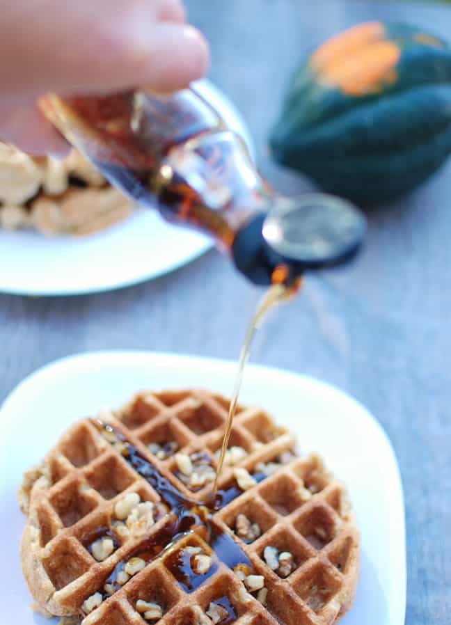 These acorn squash waffles are a perfect family breakfast on a cold winter morning! They’re healthier than most waffle recipes since they’re whole grain and contain a vegetable – plus they are easy to whip up quickly.