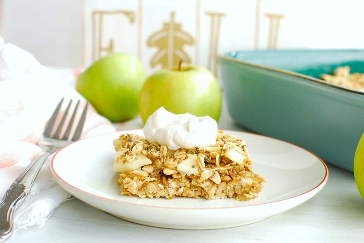 A healthy apple oatmeal bar topped with a dollop of Greek yogurt.