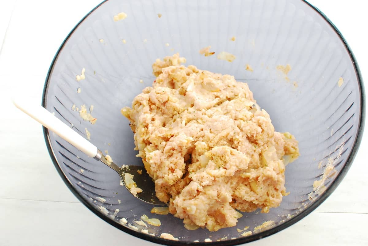 Meatball ingredients mixed together in a bowl.