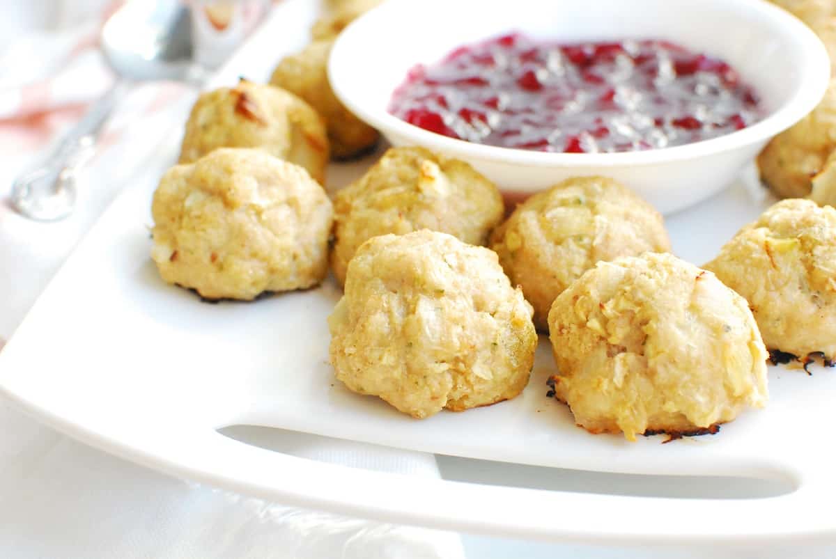 Chicken apple meatballs on a white plate.