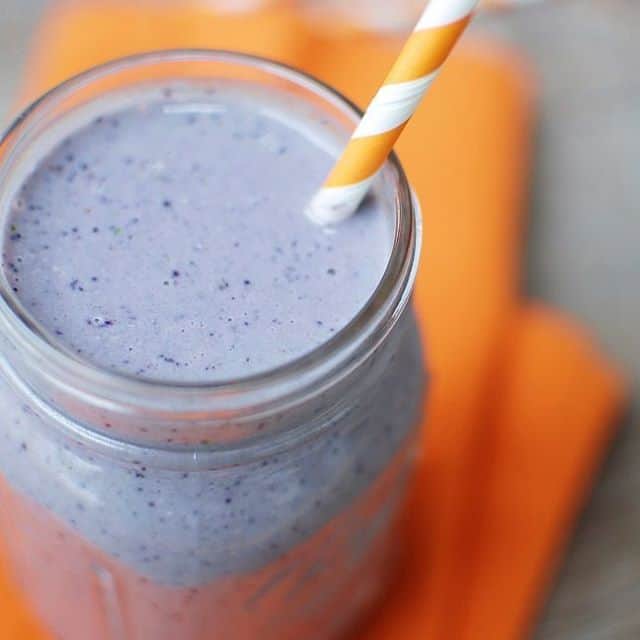 Wild blueberry smoothie in a mason jar.