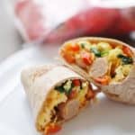 Looking for a healthy breakfast for meal prep? These make ahead breakfast burritos are just what you need! Healthy and filling, this freezer meal includes veggies for vitamins and minerals as well as eggs and chicken sausage to pack in protein.