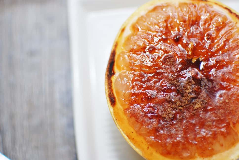 Broiled Grapefruit Close Up on a White Plate