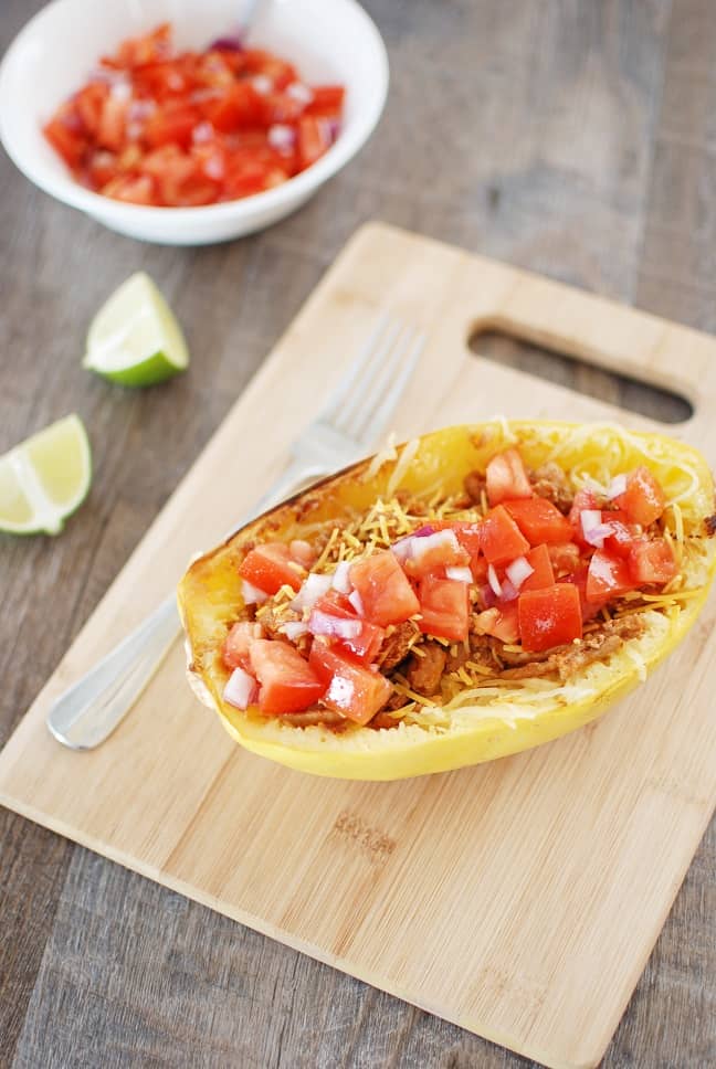 Spaghetti squash taco boats are tasty, nutritious, and perfect for a family dinner! Instead of using shells for your tacos, you simply add the meat and homemade salsa on top of roasted spaghetti squash. And at under 400 calories each, it’s a filling meal you can feel good about eating! Gluten free and dairy free options available.