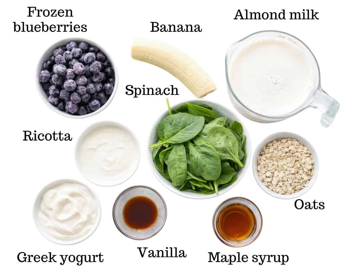 Blueberries, banana, almond milk, ricotta, greek yogurt, vanilla, spinach, maple syrup, and oats.