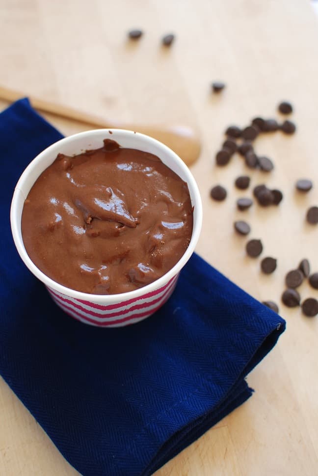 A treat cup full of healthy brownie batter for one