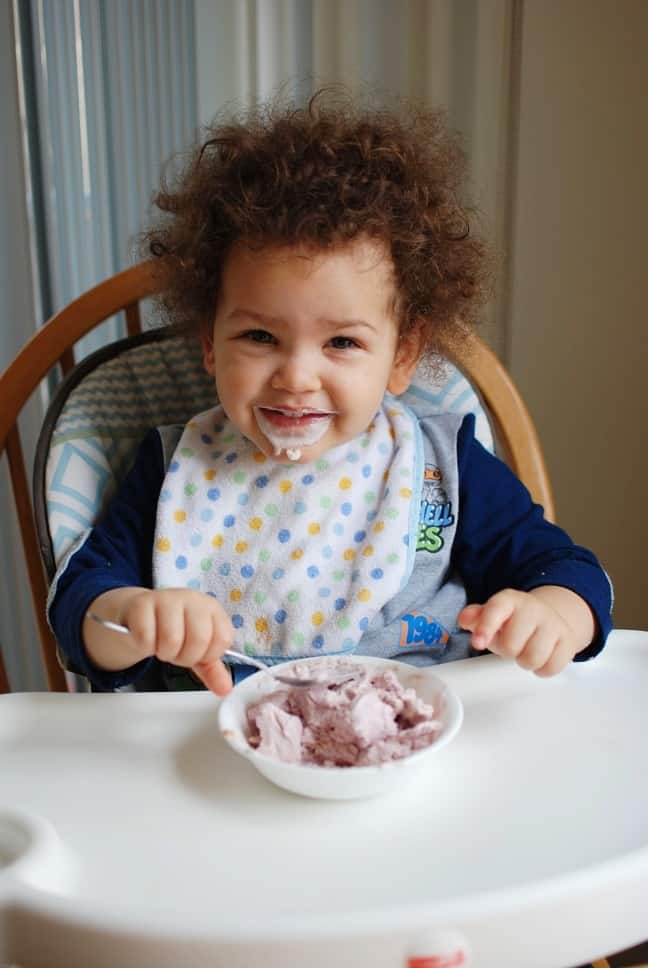 Eating homemade frozen yogurt in a bag.