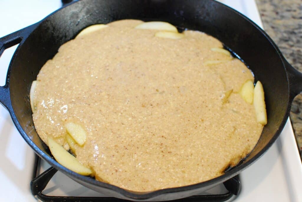 Pancake batter poured into the skillet.