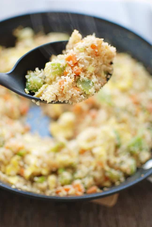 Cauliflower fried rice is a 30 minute meal that tastes like Chinese takeout – but in a healthier at home recipe! With less than 10 ingredients, you’ll have this low calorie, low carb dish. Enjoy a small portion for a side dish or a large portion for dinner! | Vegetarian | Dairy Free | Family Friendly