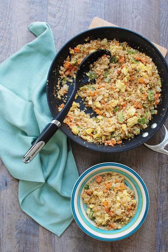 Cauliflower fried rice is a 30 minute meal that tastes like Chinese takeout – but in a healthier at home recipe! With less than 10 ingredients, you’ll have this low calorie, low carb dish. Enjoy a small portion for a side dish or a large portion for dinner! | Vegetarian | Dairy Free | Family Friendly