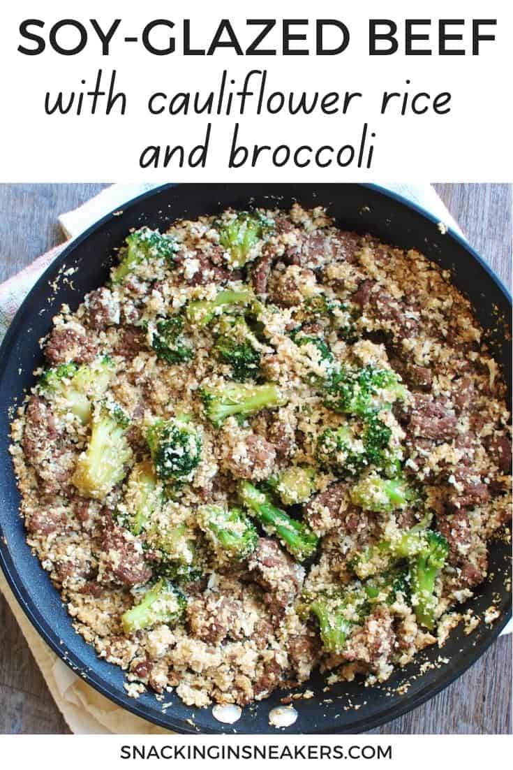 A pan filled with ground beef, cauliflower rice, broccoli, and a soy sauce mixture.