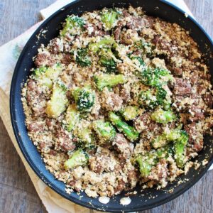 A pan filled with soy glazed ground beef, cauliflower rice, and broccoli.