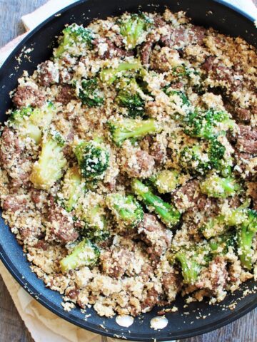 A pan filled with soy glazed ground beef, cauliflower rice, and broccoli.