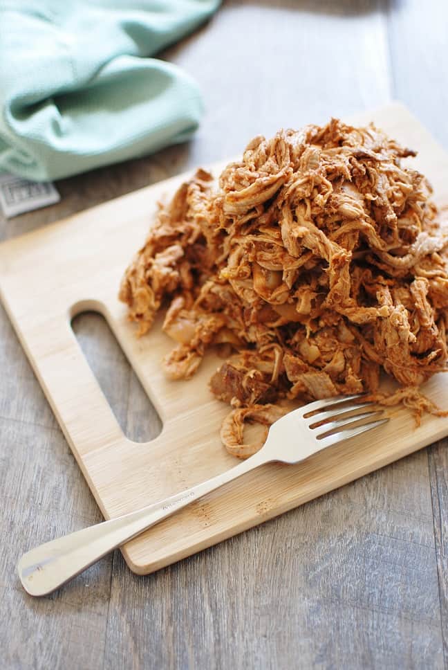 This crock pot pulled pork puts a healthy spin on a traditional favorite! Pork tenderloin means the meat is leaner, while a homemade Carolina style barbecue sauce means far less added sugar. Use it to make these pulled pork stuffed sweet potatoes, or whatever else you love to do with pulled pork! 