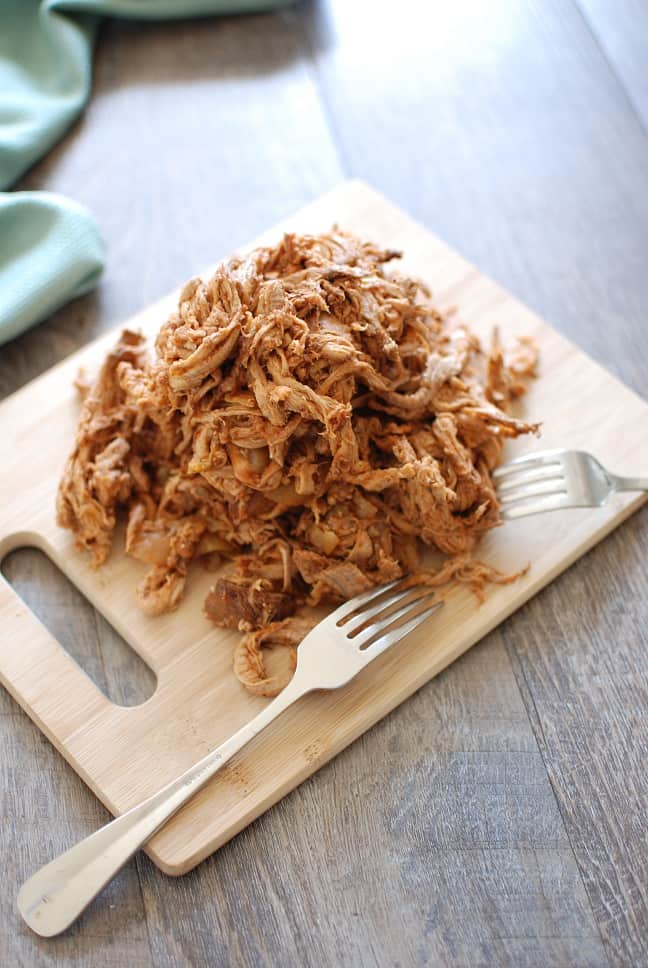 This crock pot pulled pork puts a healthy spin on a traditional favorite! Pork tenderloin means the meat is leaner, while a homemade Carolina style barbecue sauce means far less added sugar. Use it to make these pulled pork stuffed sweet potatoes, or whatever else you love to do with pulled pork! 