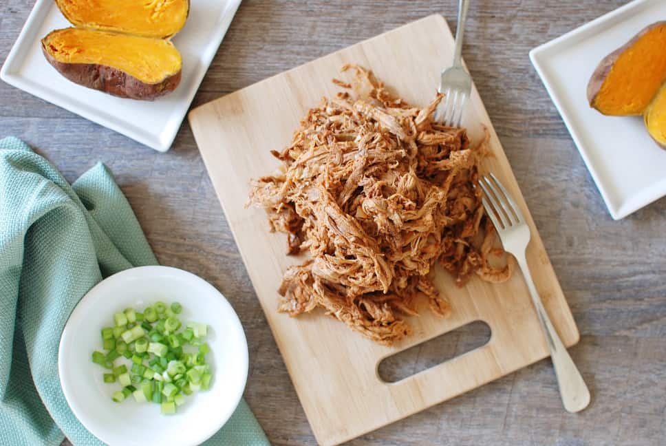 This crock pot pulled pork puts a healthy spin on a traditional favorite! Pork tenderloin means the meat is leaner, while a homemade Carolina style barbecue sauce means far less added sugar. Use it to make these pulled pork stuffed sweet potatoes, or whatever else you love to do with pulled pork! 
