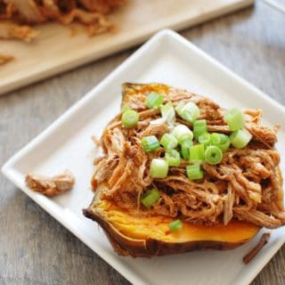 This crock pot pulled pork puts a healthy spin on a traditional favorite! Pork tenderloin means the meat is leaner, while a homemade Carolina style barbecue sauce means far less added sugar. Use it to make these pulled pork stuffed sweet potatoes, or whatever else you love to do with pulled pork!