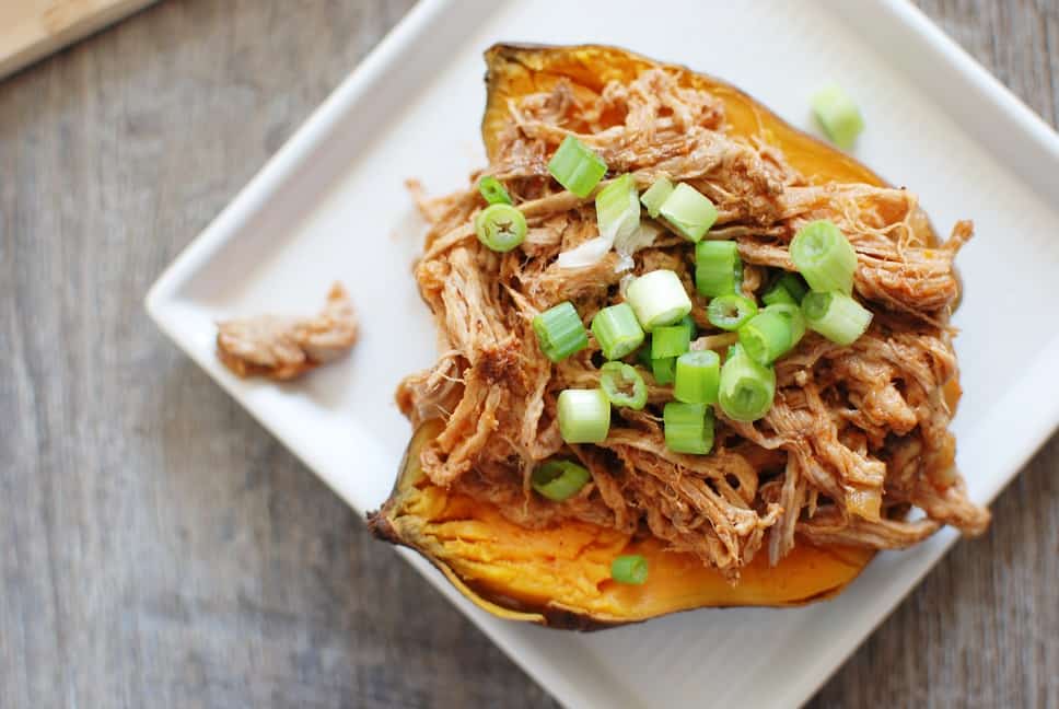 This crock pot pulled pork puts a healthy spin on a traditional favorite! Pork tenderloin means the meat is leaner, while a homemade Carolina style barbecue sauce means far less added sugar. Use it to make these pulled pork stuffed sweet potatoes, or whatever else you love to do with pulled pork! 