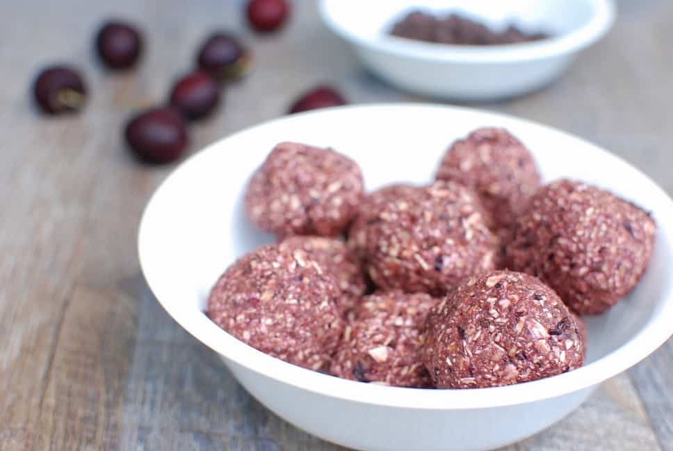 A bowl of chocolate cherry energy balls.