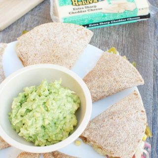 These vegetarian quesadillas with corn, tomatillos, and cheese are perfect for your summer get togethers!