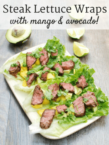 A platter full of steak lettuce wraps with mango and avocado
